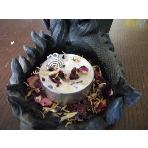 Offer Spell Infused Spiral Charm with Magickal Candle for Good Health